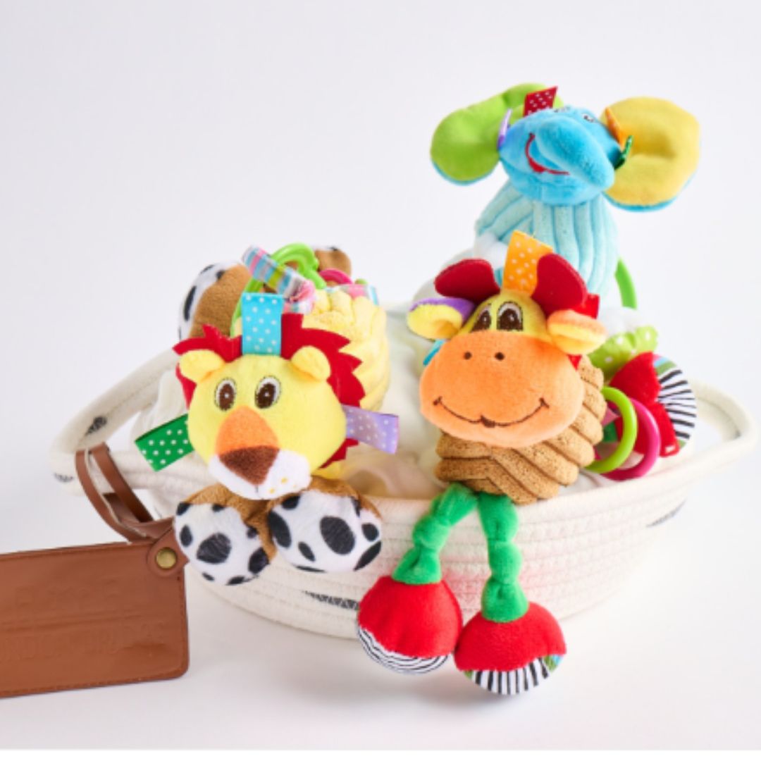 Three Jiglgy Giggly toys from London Bridge: elphant, lion, and monkey.